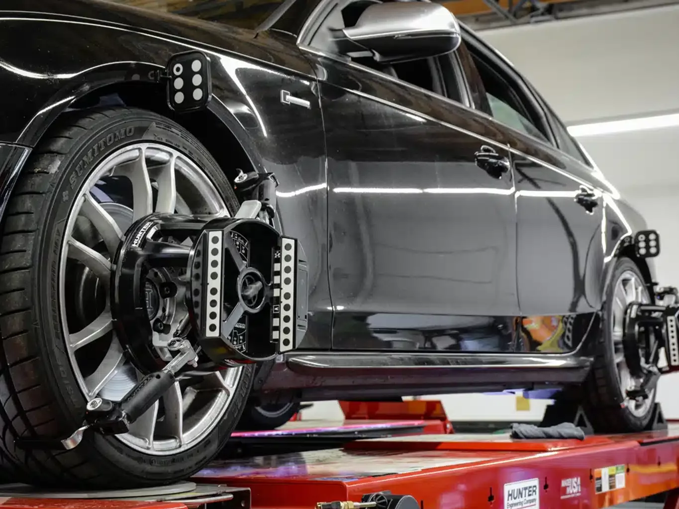 State-of-the-art Hunter wheel alignment system in use at Limitless Tire, providing precision service.